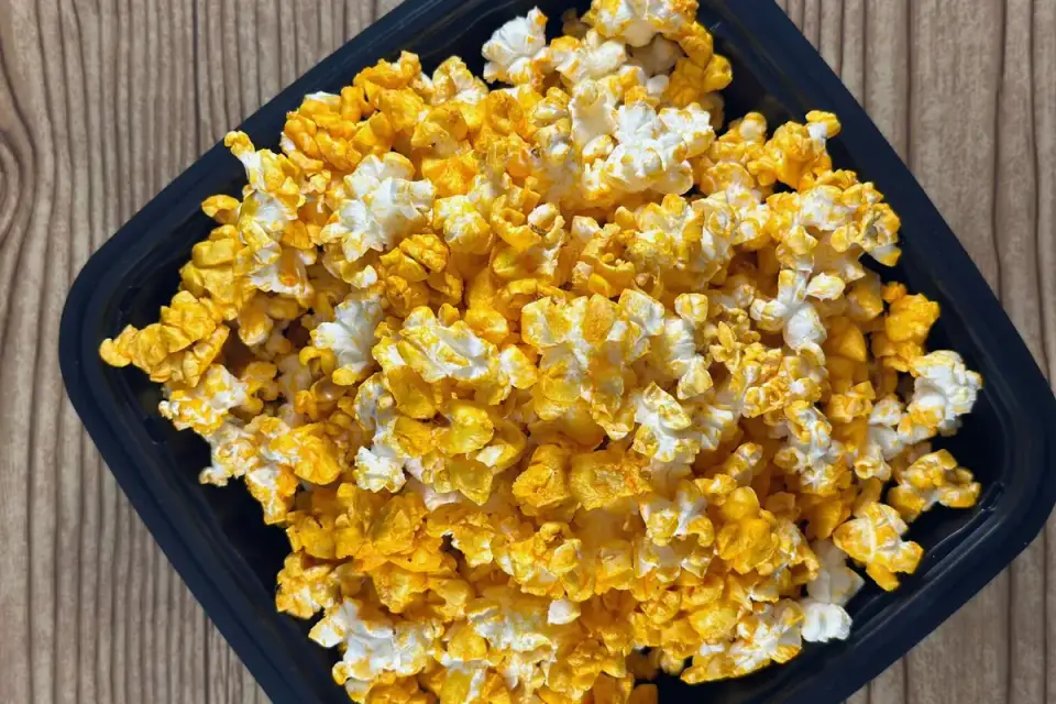 A bowl of plain, unsalted popcorn on a kitchen table