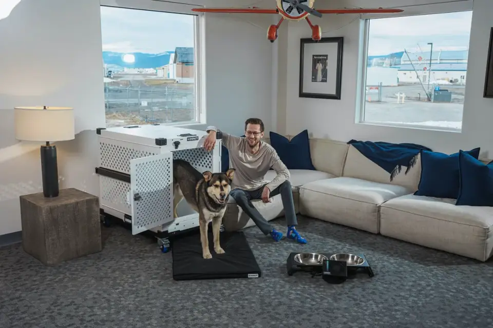 A veterinarian speaking with a dog owner during an exam room consultation