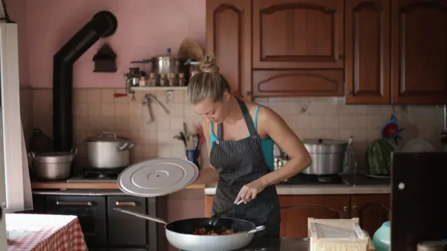 Dog owner preparing a meal