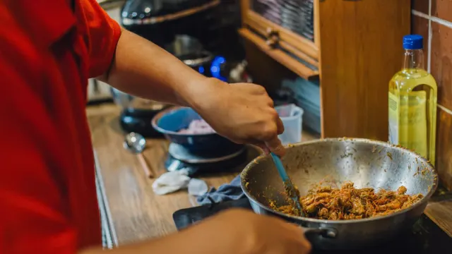 Dog owner preparing a meal