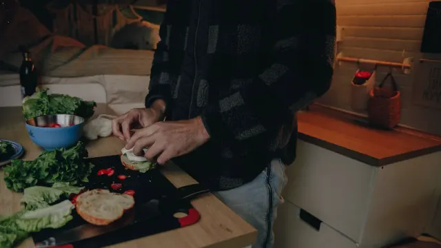 Dog owner preparing a meal