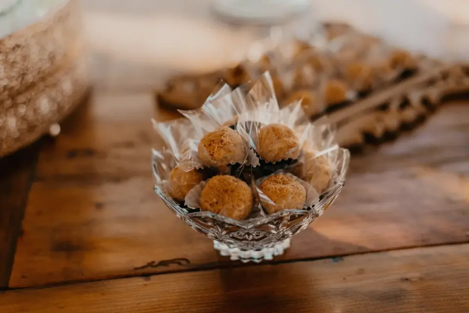 Several air-dried soft chew supplement pieces arranged on a wooden table